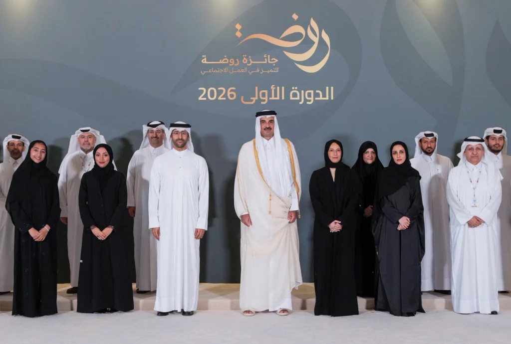 Amir of Qatar poses with officials and winners at the inaugural Rawda Award for Excellence in Social Work ceremony, 2026.